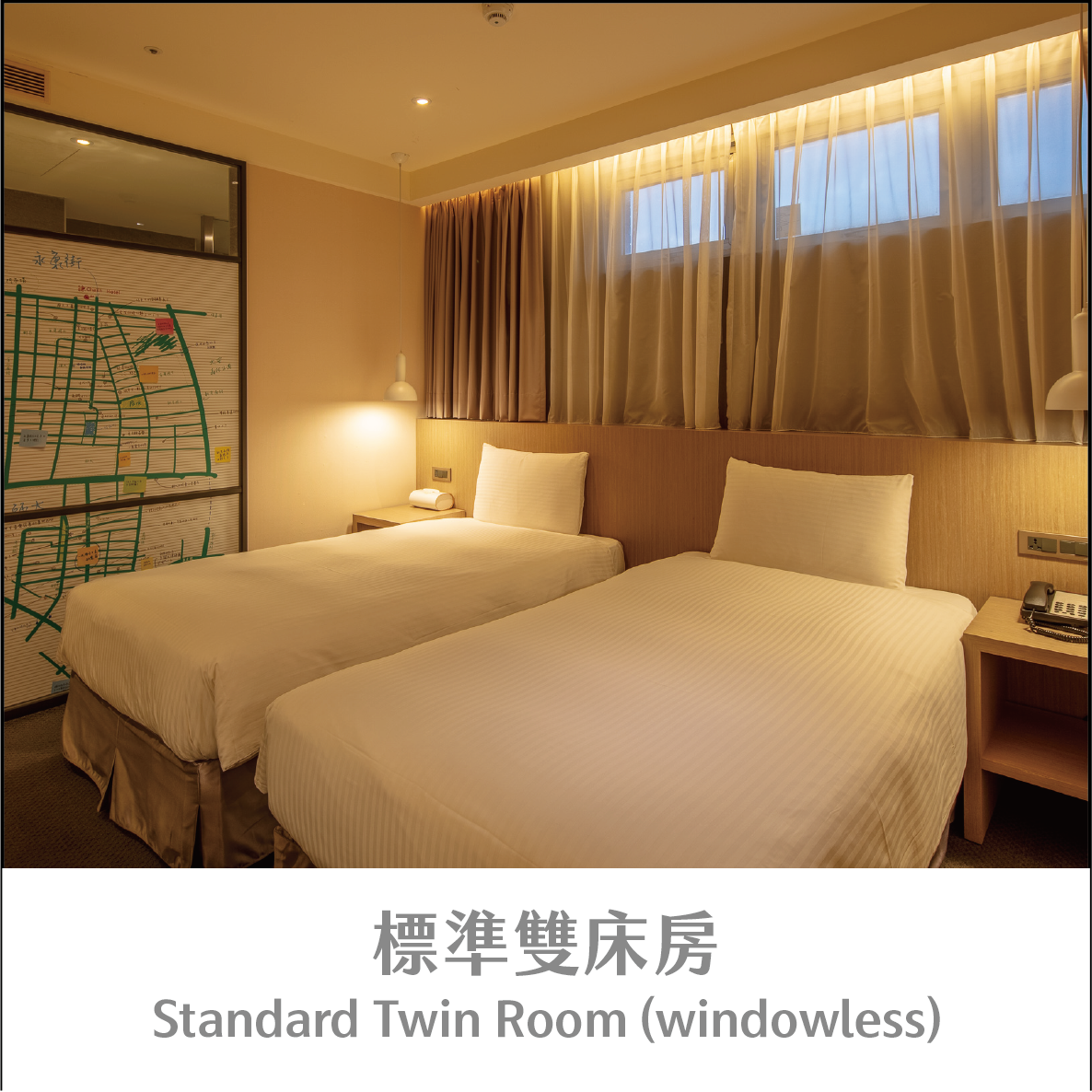 Two separate single beds in the official Standard Twin Room photograph at Chaiin Hotel Dongmen, labelled windowless